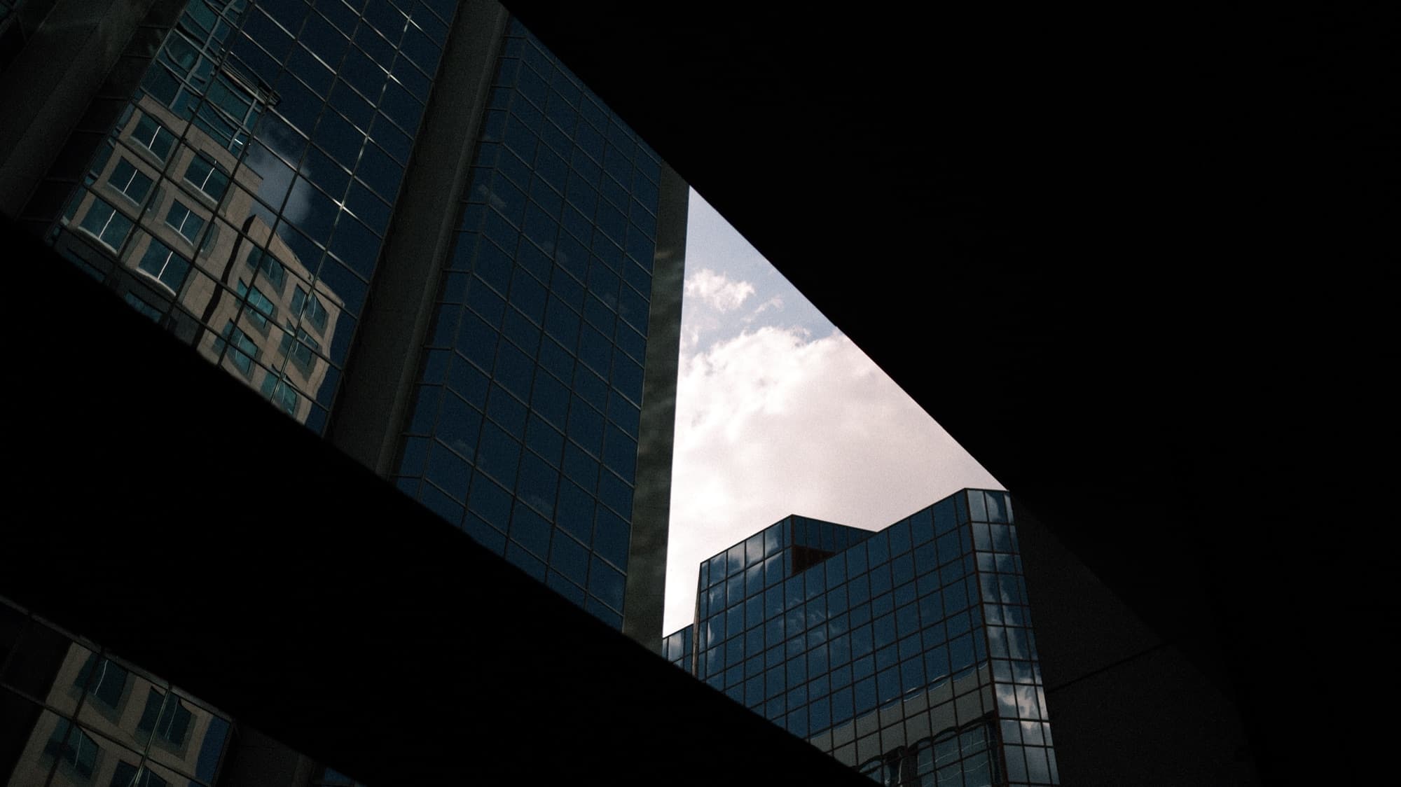 Abstract view of glass office towers and sky