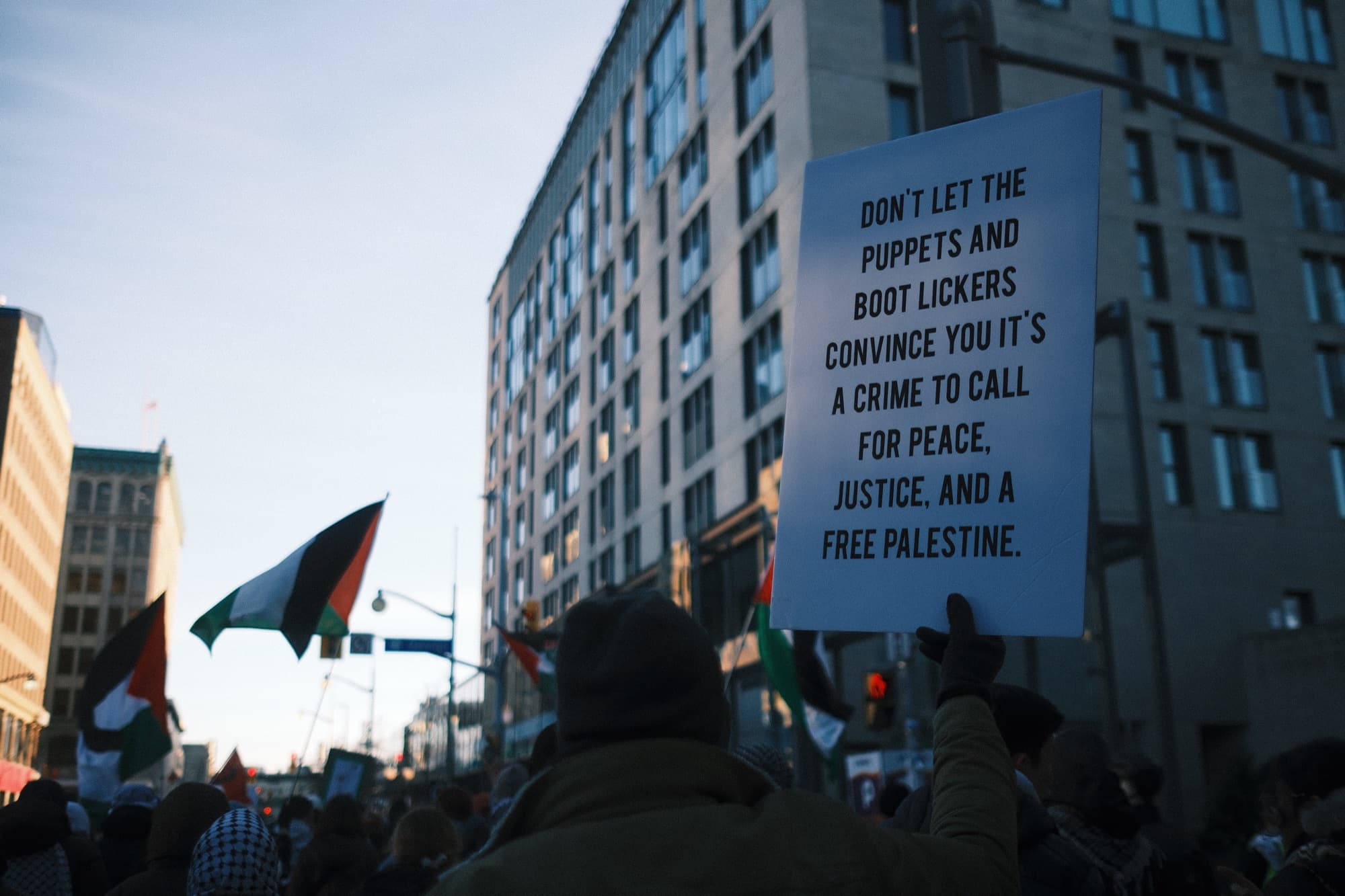 Protest sign reading a call for peace and justice