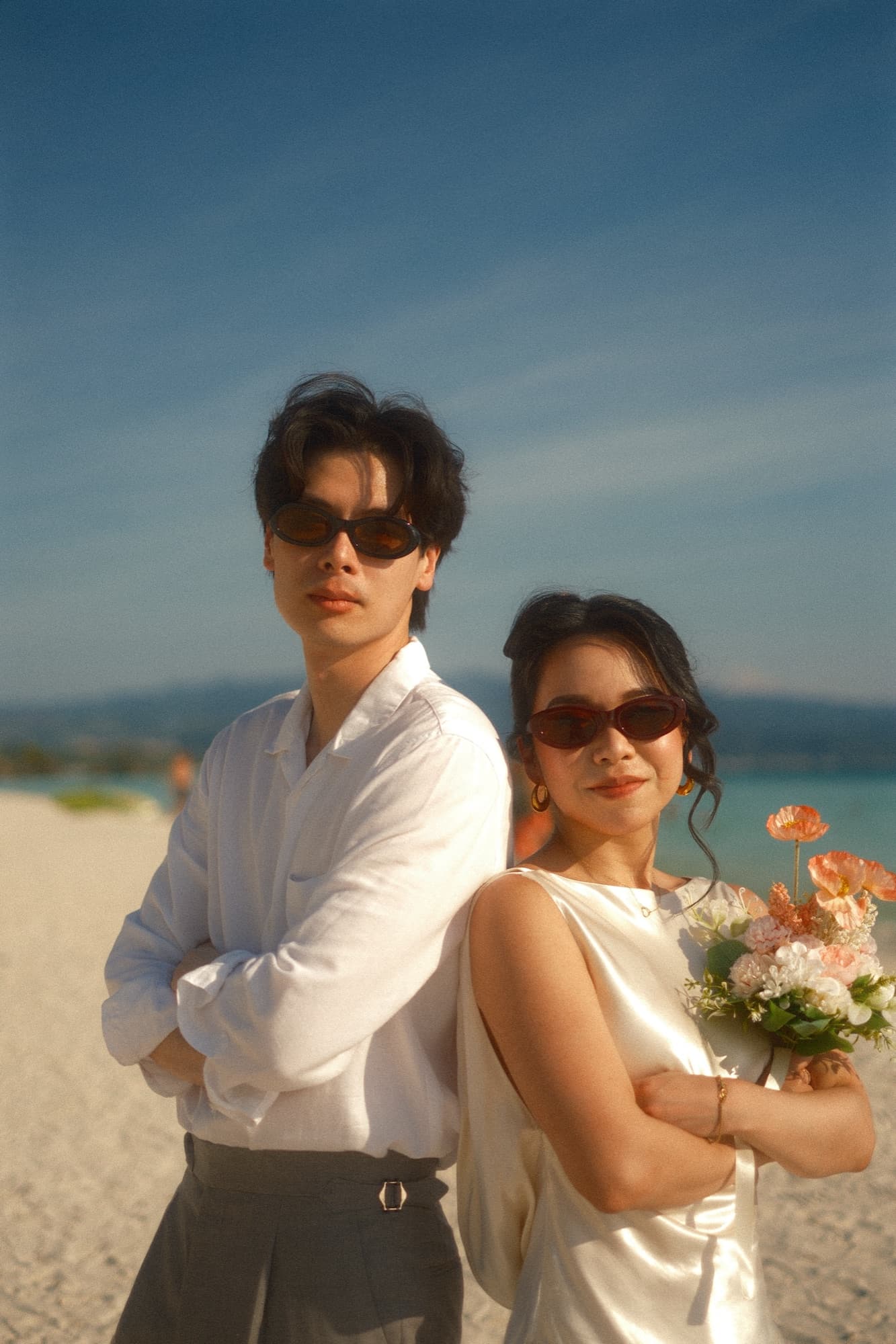 Couple embracing on the beach at sunset